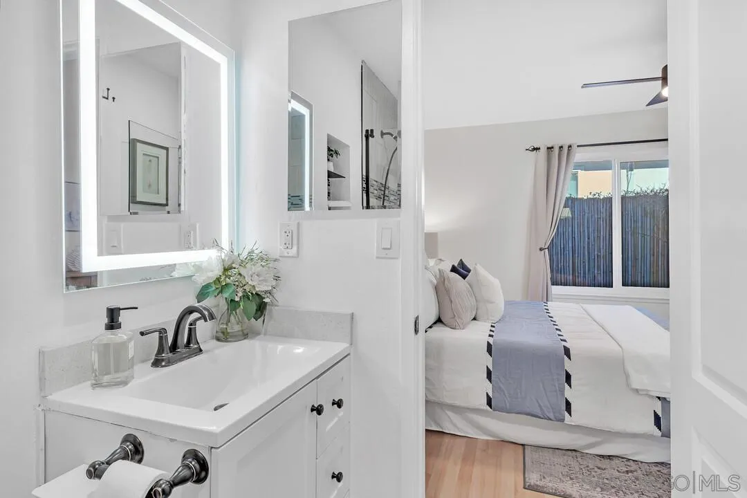 11021 Sagittarius Road San Diego, CA 92126 - Photo 17 of 28 a bathroom with a sink and mirror