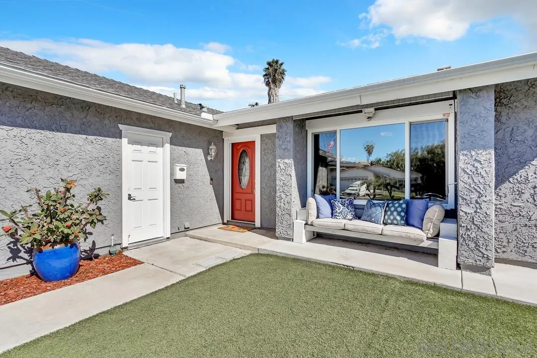 11021 Sagittarius Road San Diego, CA 92126 - Photo 2 of 28 a bedroom with furniture and a potted plant