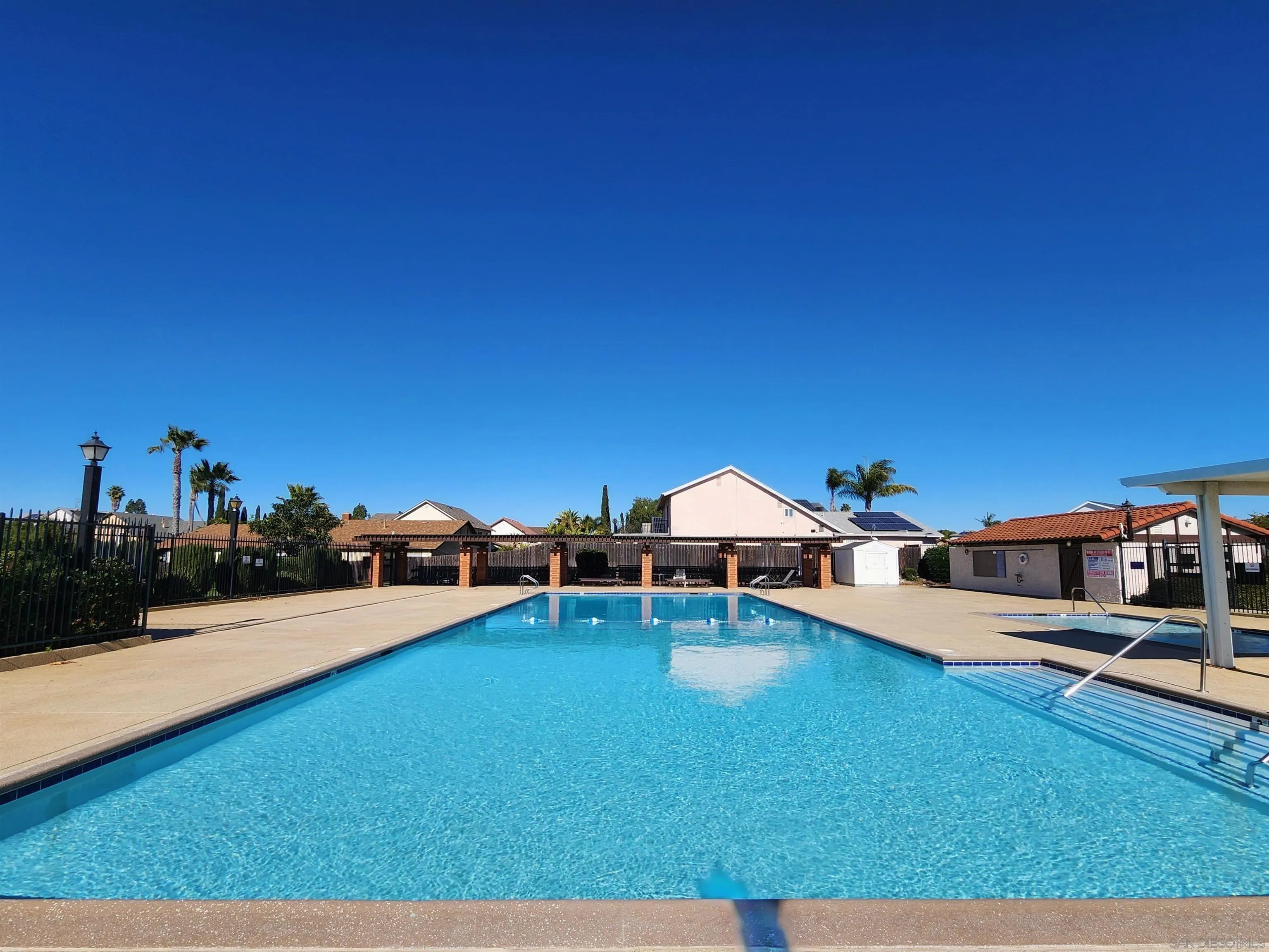 11021 Sagittarius Road San Diego, CA 92126 - Photo 27 of 28 a view of a swimming pool with a lounge chair