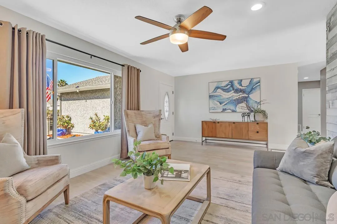 11021 Sagittarius Road San Diego, CA 92126 - Photo 4 of 28 a living room with furniture and a large window