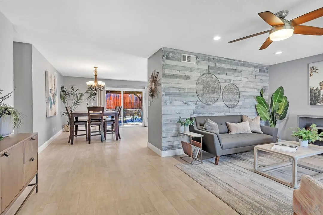11021 Sagittarius Road San Diego, CA 92126 - Photo 6 of 28 a living room with furniture and wooden floor