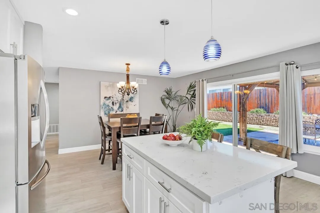 11021 Sagittarius Road San Diego, CA 92126 - Photo 10 of 28 a dining room with furniture and window