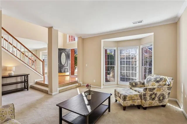 a living room with furniture and windows