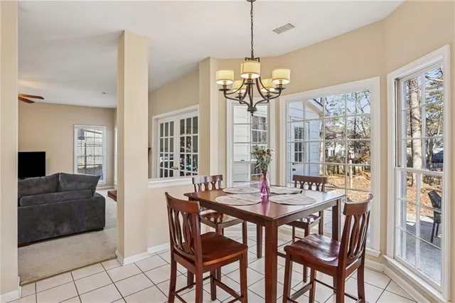 a view of a dining room with furniture window and outside view