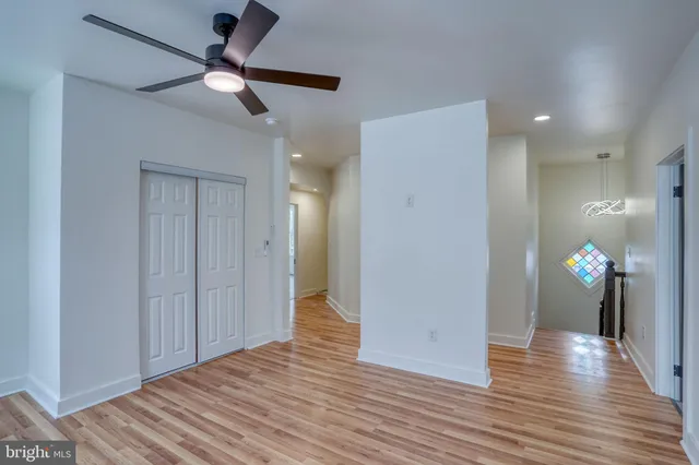 a bathroom with a sink a toilet a mirror and shower