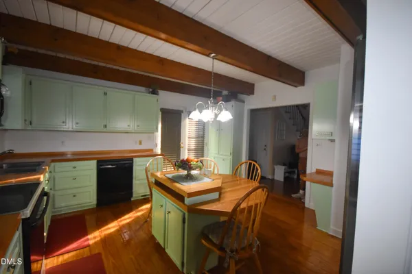 a bathroom with a shower and a sink