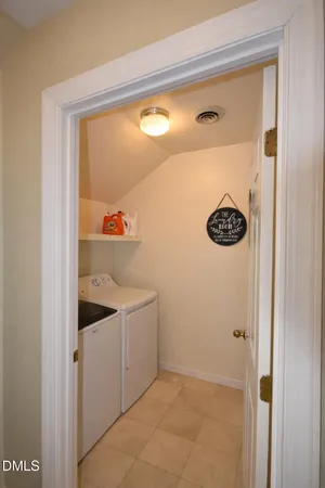 a living room with furniture a pool table and a fireplace