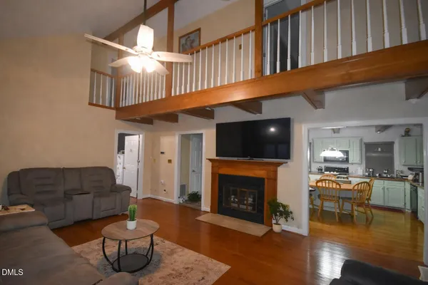 a bathroom with a sink vanity and shower