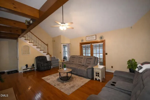 a room with a white bed and cabinets