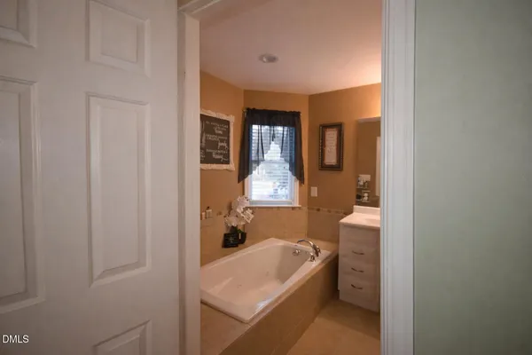 a spacious bedroom with a bed and a couch