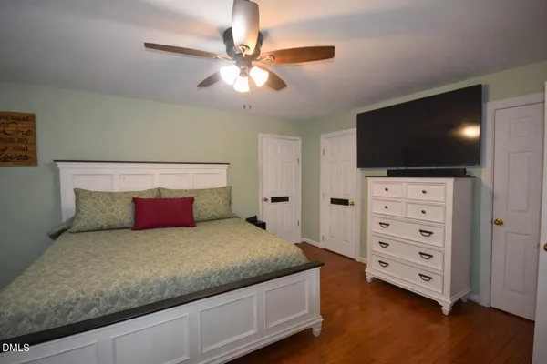 a view of balcony with two chairs and a potted plant