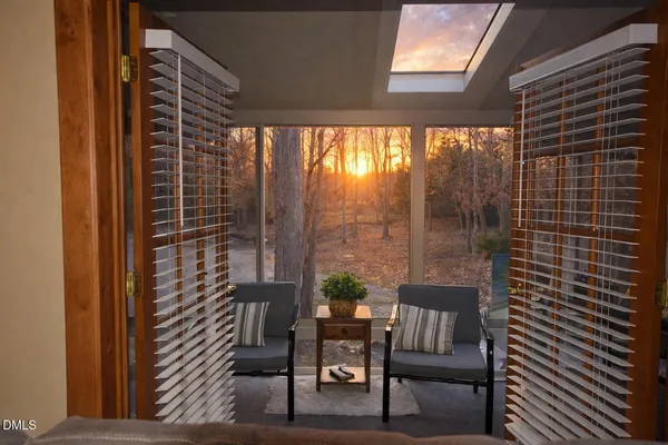 a bathroom with a granite countertop toilet sink and mirror