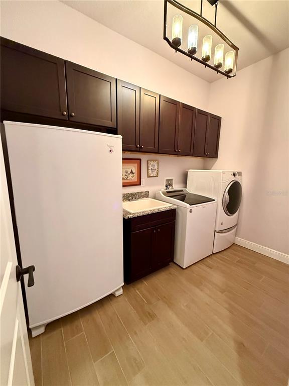 13110 Bamboo Street Spring Hill, FL 34609 - Photo 37 of 56 a kitchen with stainless steel appliances a refrigerator and a stove top oven