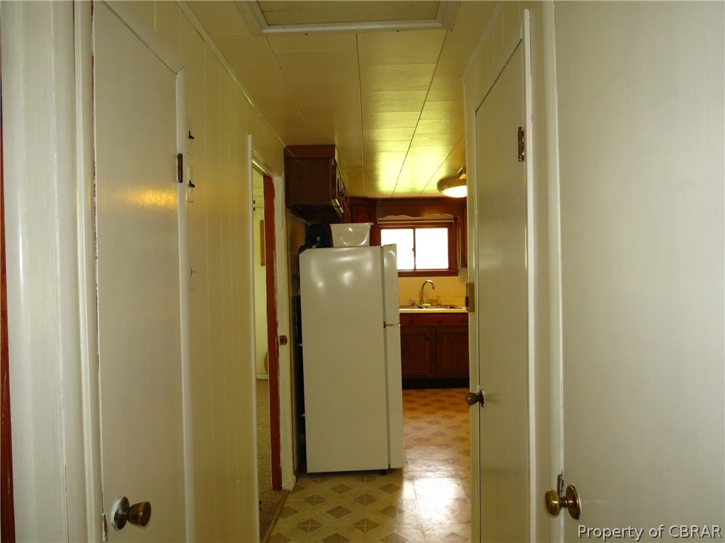912 Carlton Road Wake, VA 23176 - Photo 11 of 21 View From Hall Towards Kitchen - Good Storage and Whole House Fan
