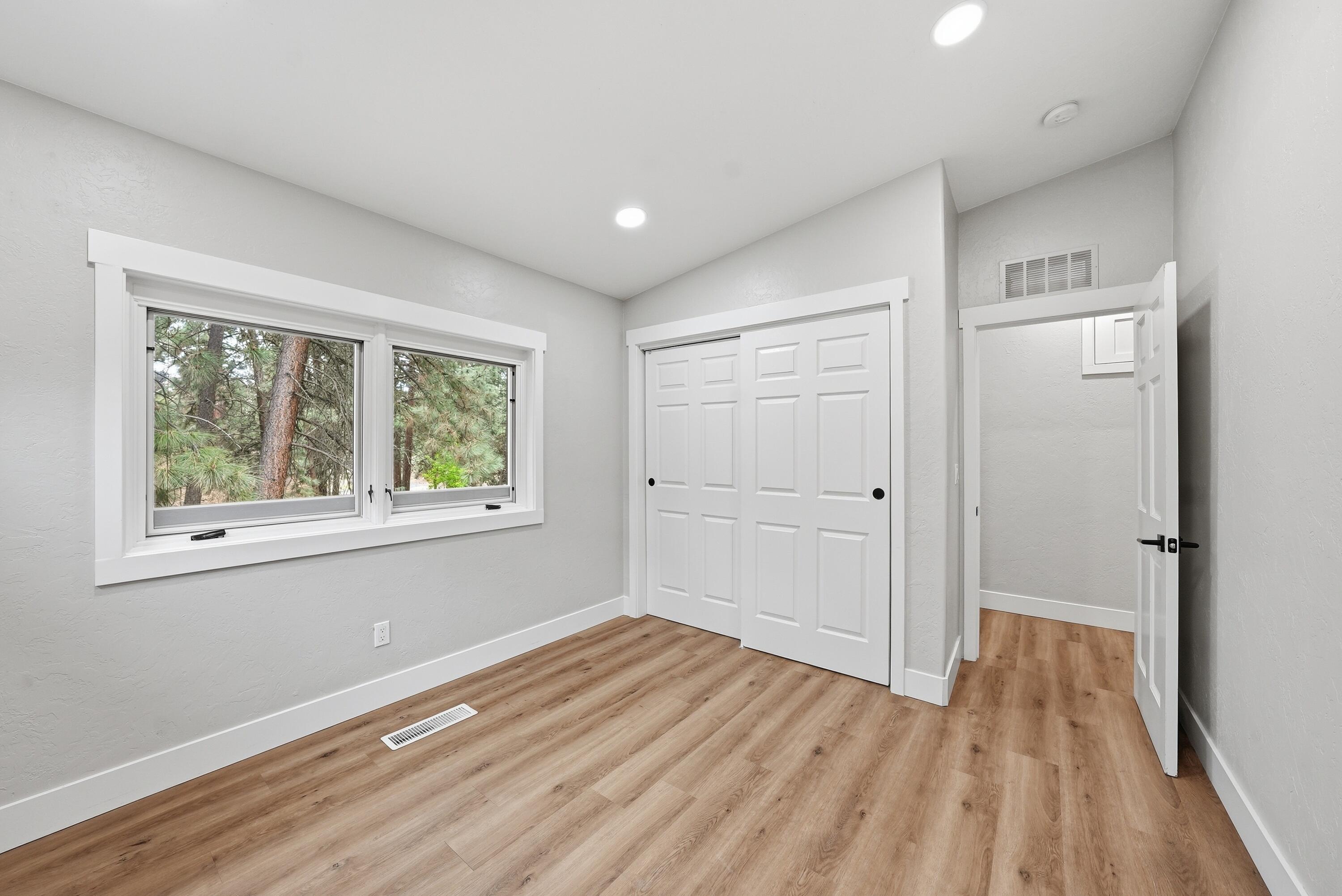 1961 Southwest Knoll Avenue Bend, OR 97702 - Photo 25 of 53 a view of a room with wooden floor and window