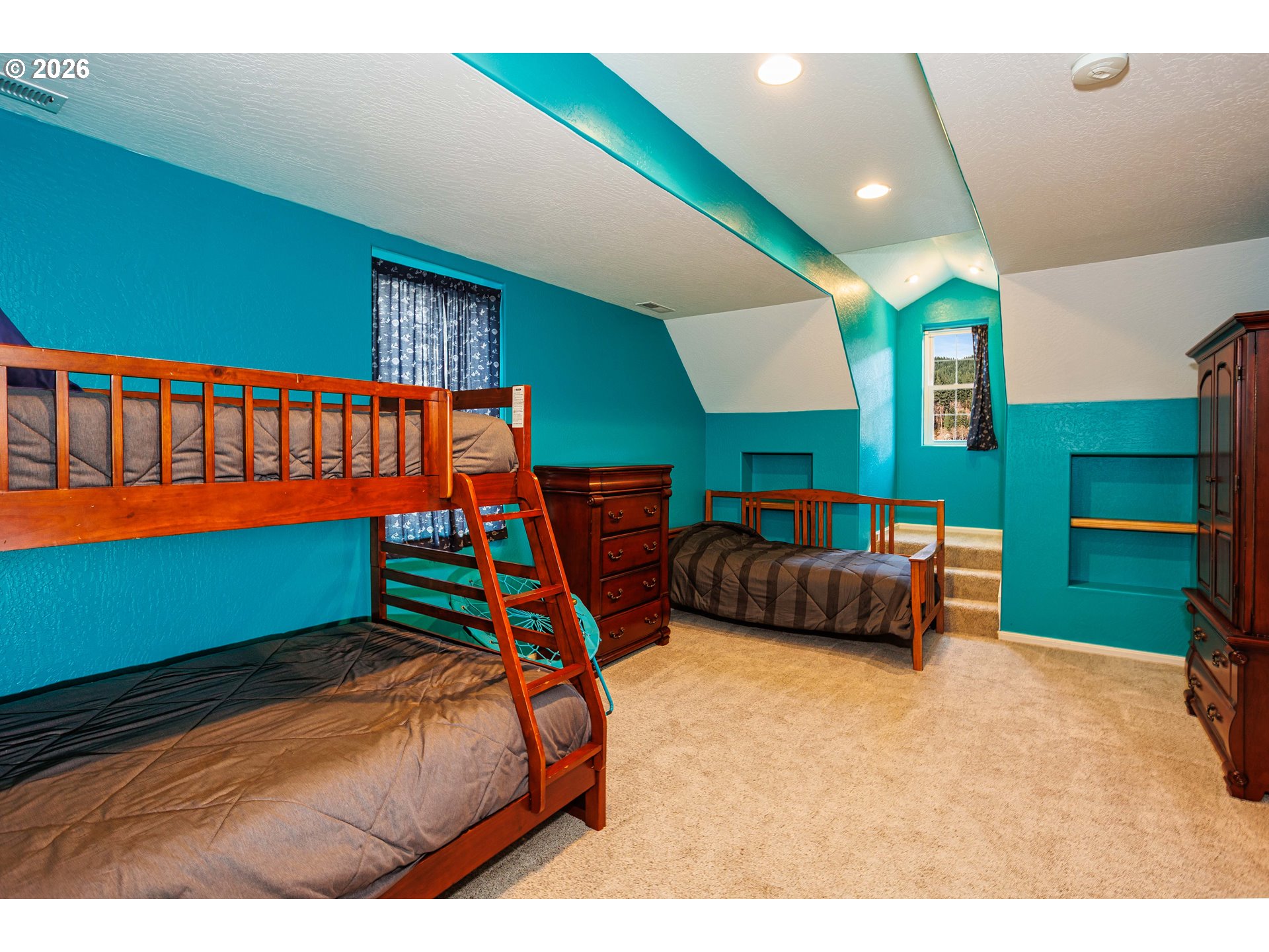 71381 Fishhawk Road Birkenfeld, OR 97016 - Photo 15 of 26 a bedroom with a bed and a window