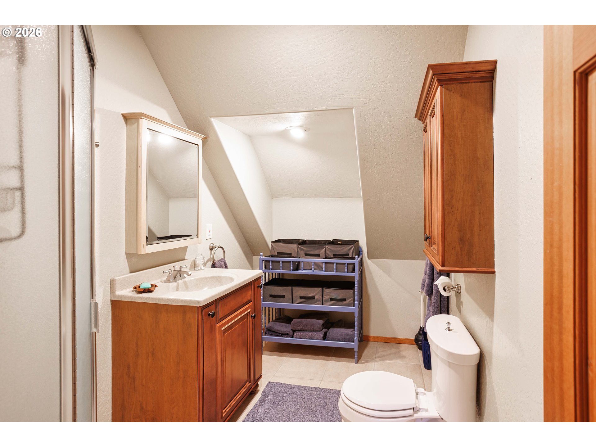 71381 Fishhawk Road Birkenfeld, OR 97016 - Photo 16 of 26 a bathroom with a sink a toilet and a mirror