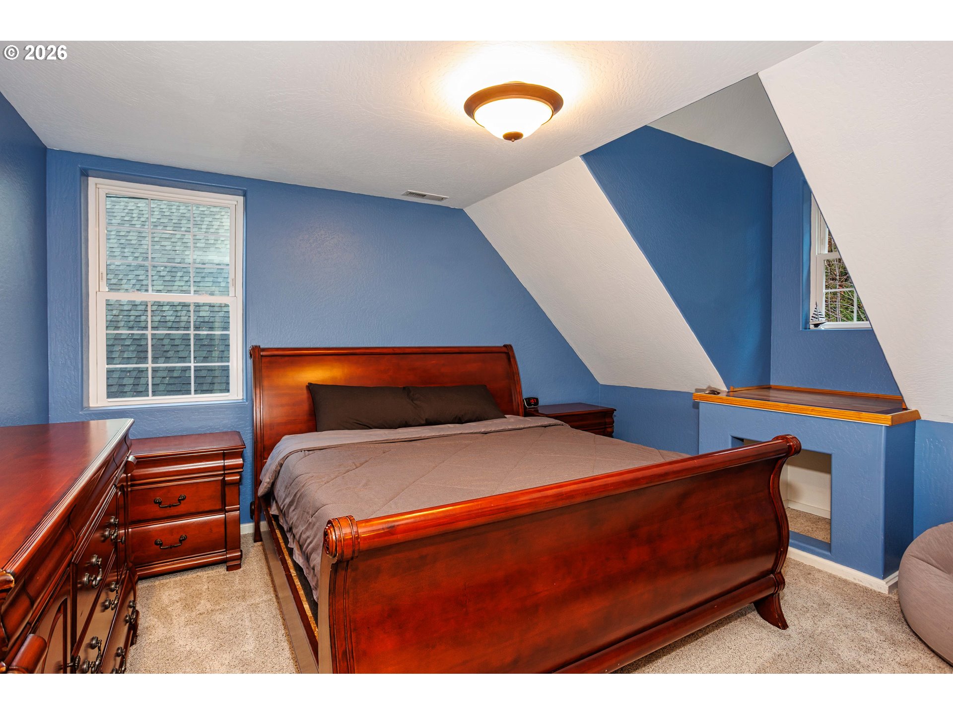 71381 Fishhawk Road Birkenfeld, OR 97016 - Photo 17 of 26 a bedroom with a bed and a potted plant