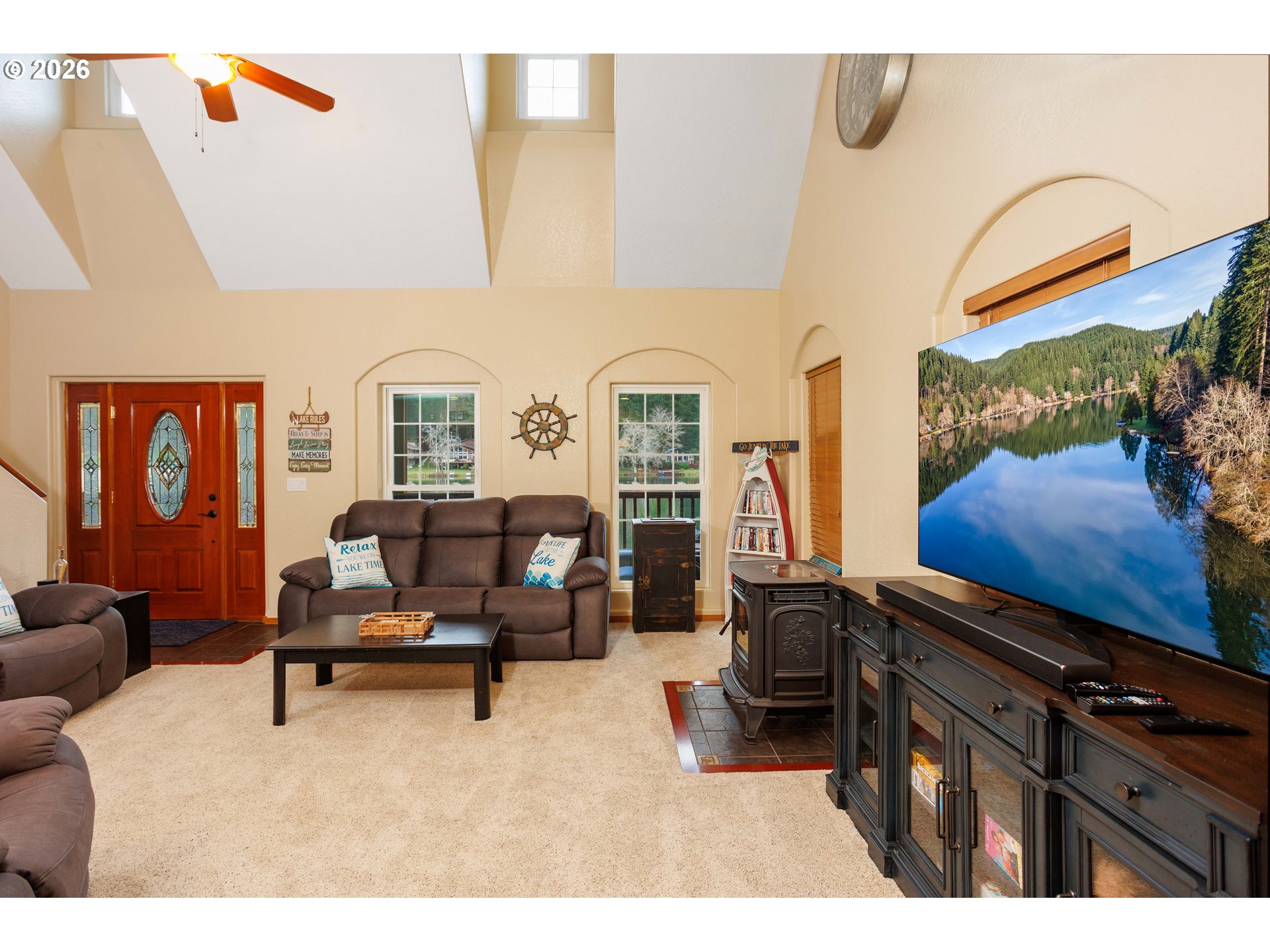71381 Fishhawk Road Birkenfeld, OR 97016 - Photo 6 of 26 a living room with furniture gym equipment and a flat screen tv