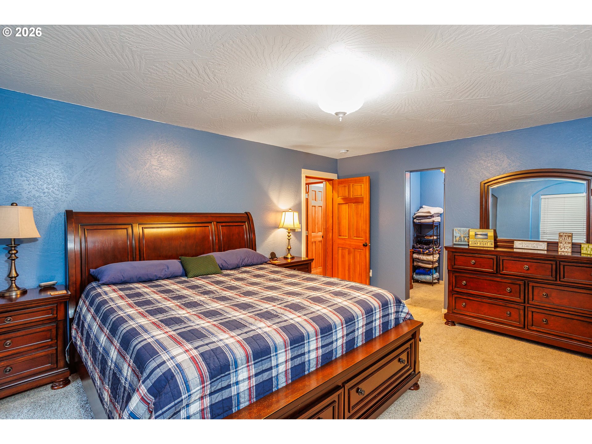 71381 Fishhawk Road Birkenfeld, OR 97016 - Photo 10 of 26 a bedroom with a bed and a dresser