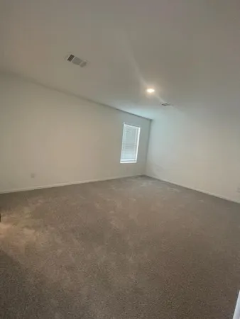 an empty room with a empty space and window