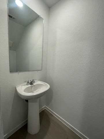 275 Lisa Marie Drive Angleton, TX 77515 - Photo 6 of 21 a bathroom with a sink and a mirror