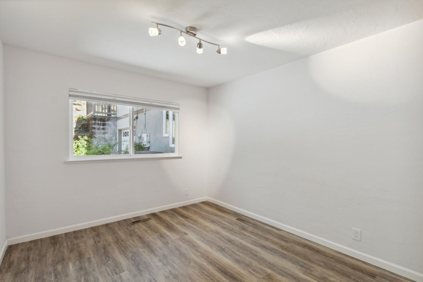 24895 Skyland Road Los Gatos, CA 95033 - Photo 37 of 113 wooden floor in an empty room with a window