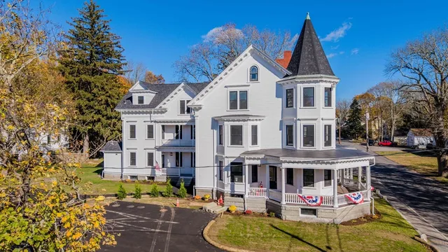 a view of multiple houses with a yard