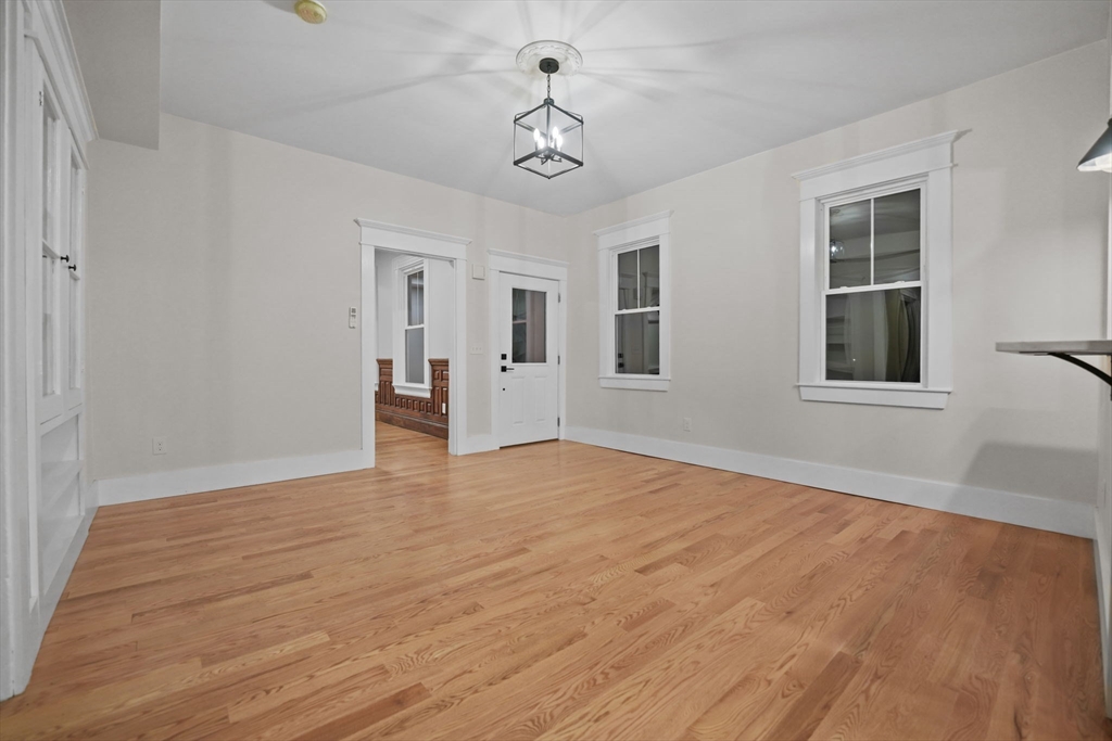 16 Water Street, Unit B Freetown, MA 02702 - Photo 7 of 22 a view of empty room with wooden floor and windows