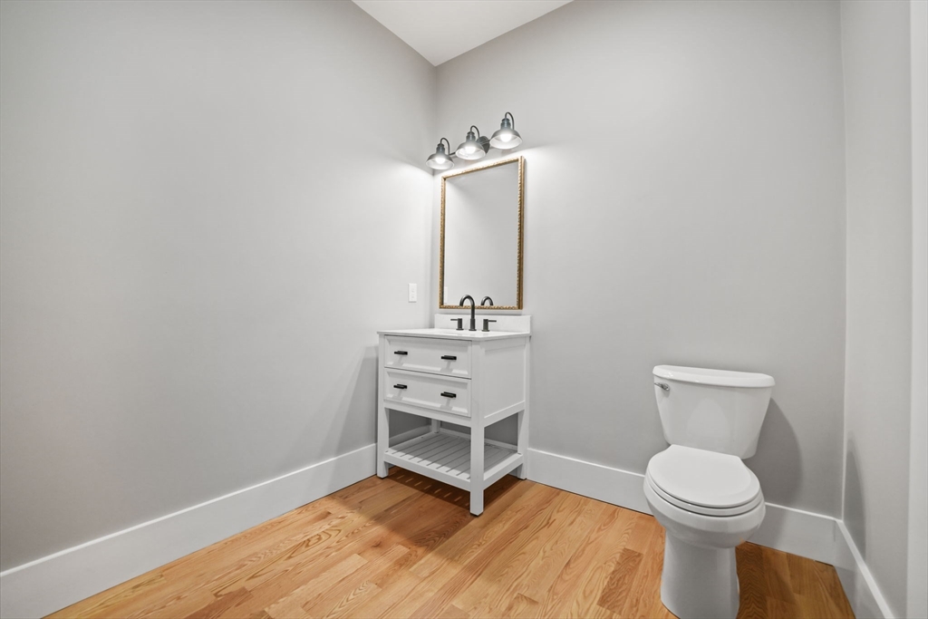16 Water Street, Unit B Freetown, MA 02702 - Photo 8 of 22 a bathroom with a toilet sink and mirror