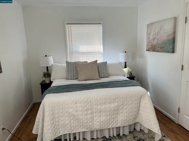 a bedroom with a bed and window