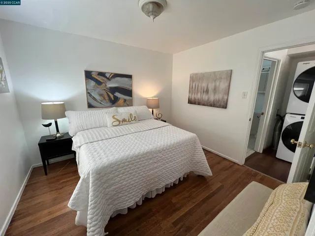 a bedroom with a bed and a tv