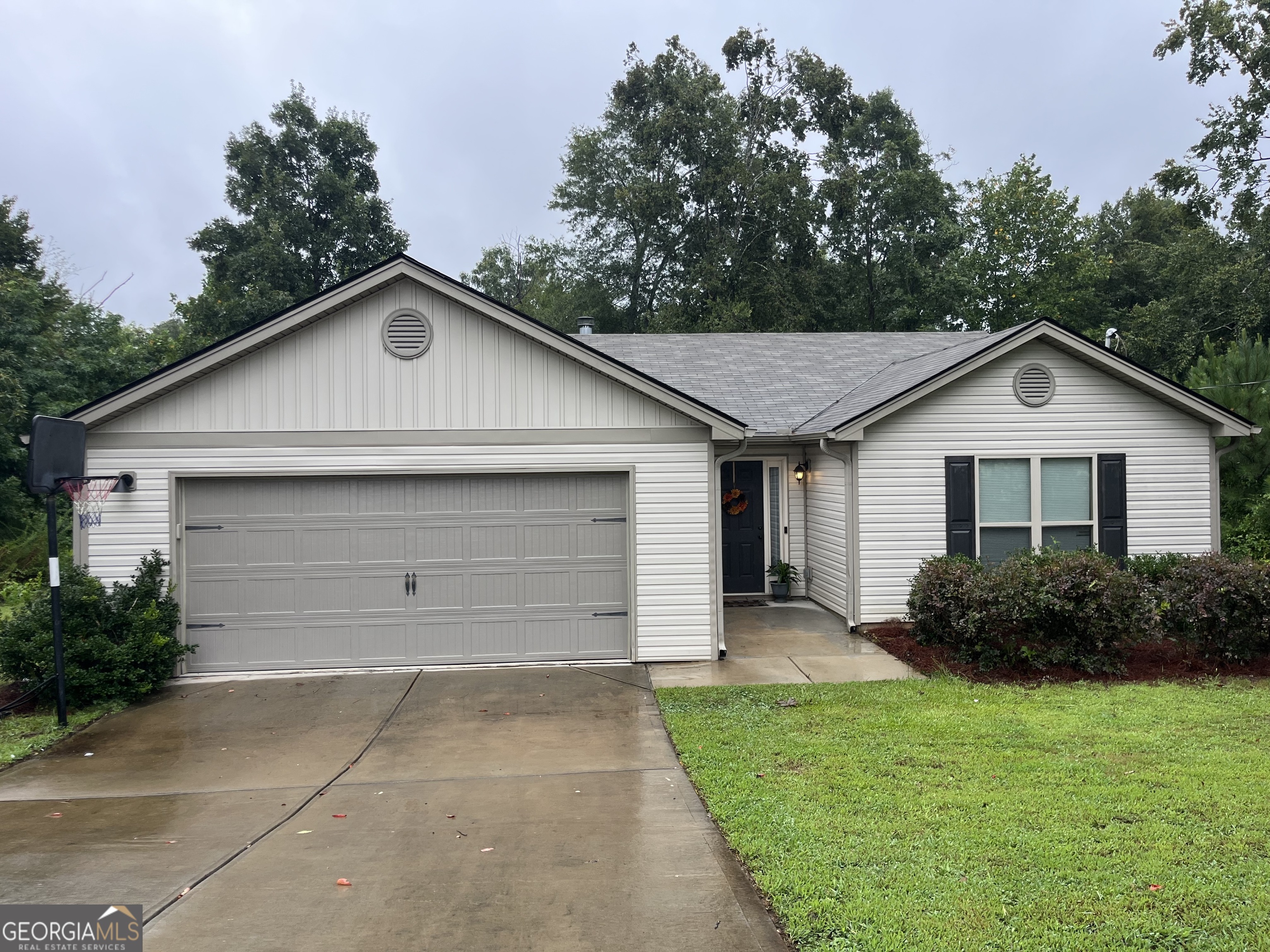 531 Shoal Creek Road Colbert, GA 30628 - Photo 1 of 1 a front view of a house with a yard and garage