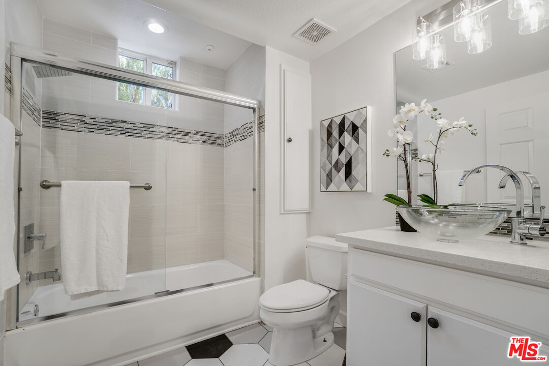 12963 West Runway Road, Unit 121 Playa Vista, CA 90094 - Photo 22 of 46 a bathroom with a sink a toilet and shower