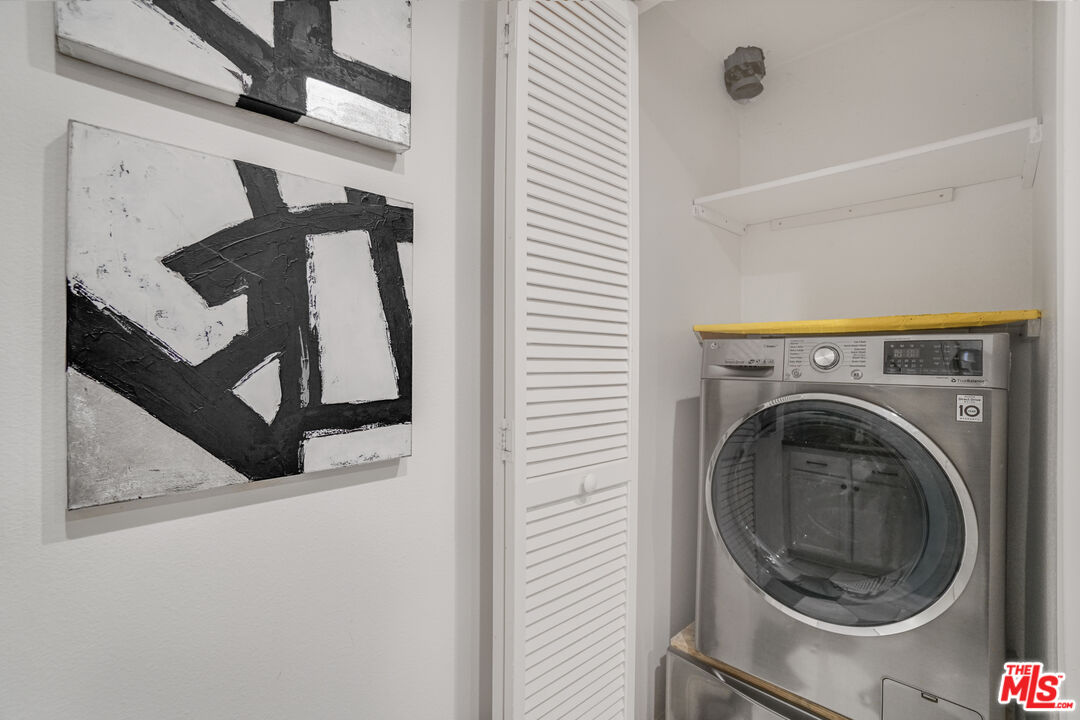 12963 West Runway Road, Unit 121 Playa Vista, CA 90094 - Photo 24 of 46 a utility room with dryer and washer