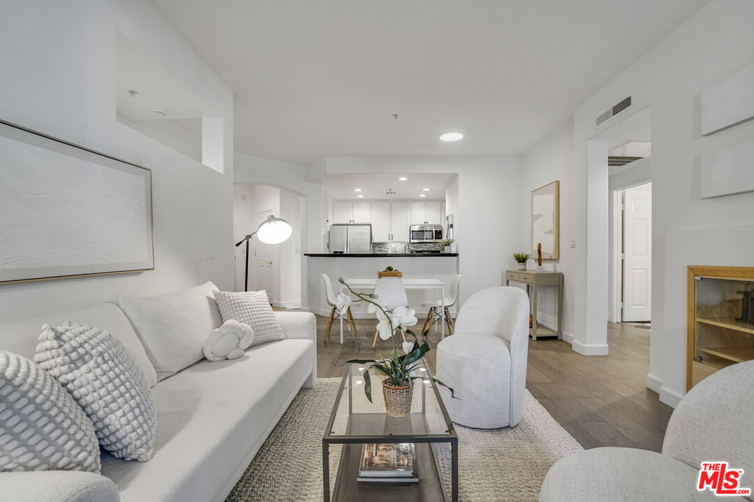 12963 West Runway Road, Unit 121 Playa Vista, CA 90094 - Photo 5 of 46 a living room with furniture and a view of kitchen