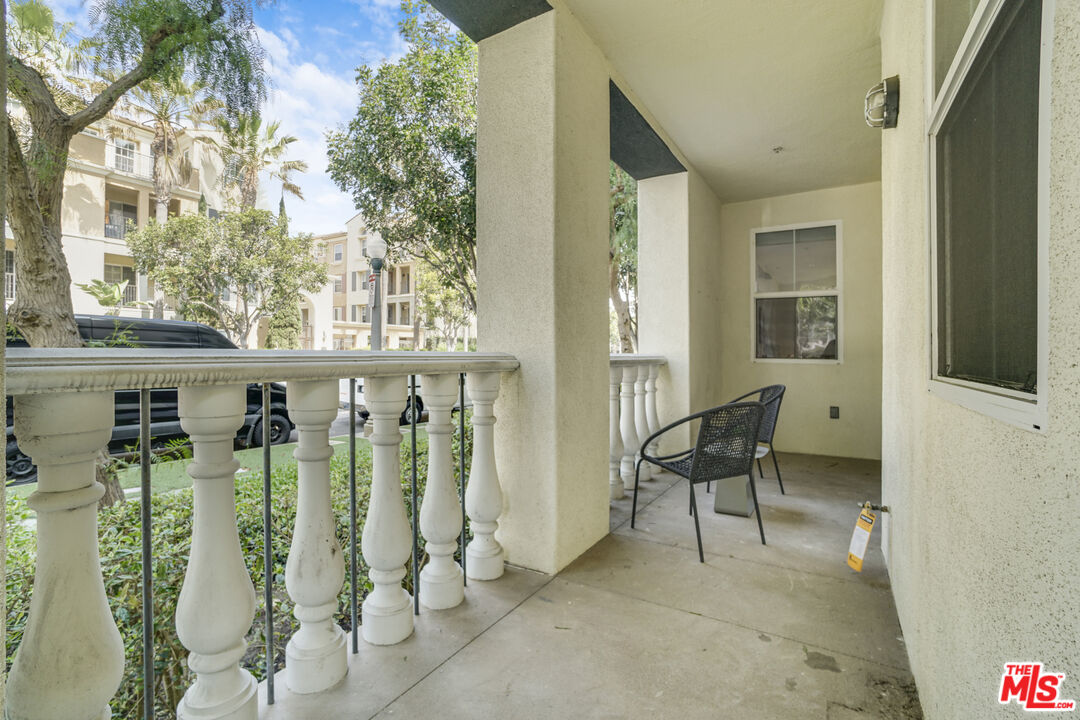 12963 West Runway Road, Unit 121 Playa Vista, CA 90094 - Photo 8 of 46 a view of a balcony with chairs
