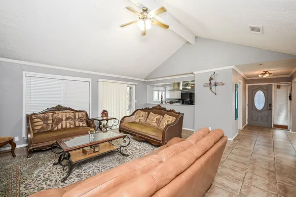 a living room with furniture and a rug