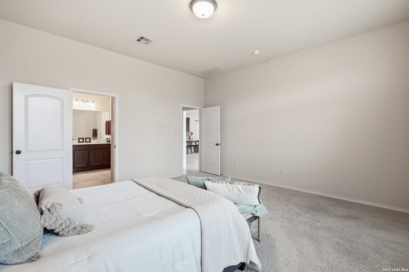 2129 Range Road Seguin, TX 78155 - Photo 23 of 41 a bedroom with a bed and a mirror