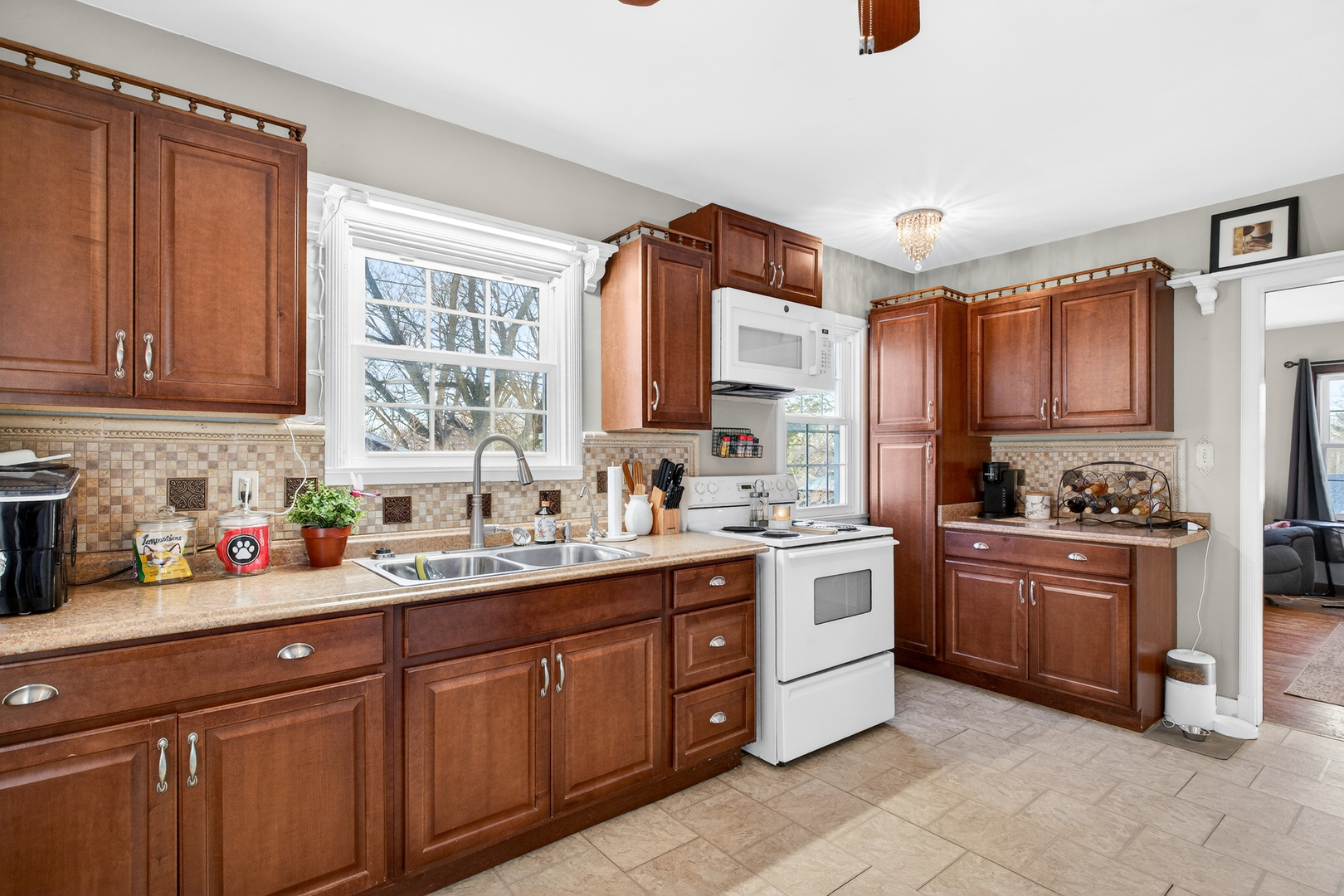 1336 Florence Avenue Clinton, IA 52732 - Photo 11 of 17 a kitchen with a sink stove and cabinets