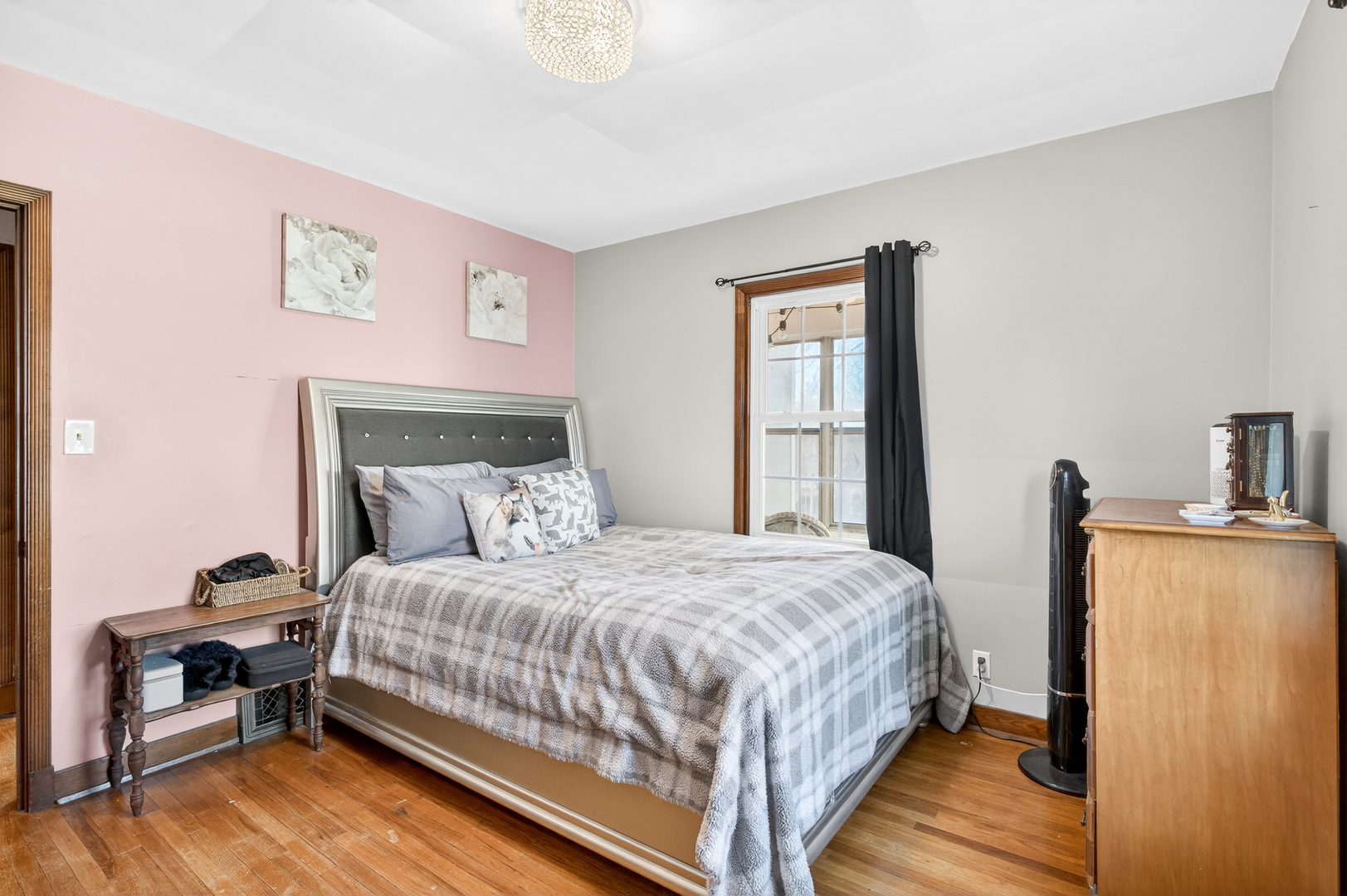 1336 Florence Avenue Clinton, IA 52732 - Photo 12 of 17 a bedroom with a bed and wooden floor