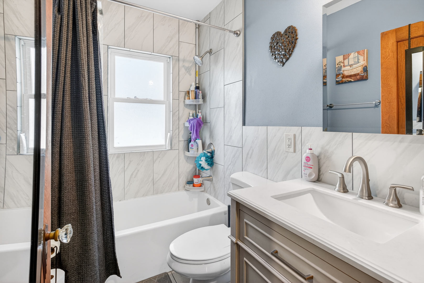 1336 Florence Avenue Clinton, IA 52732 - Photo 16 of 17 a bathroom with a sink toilet and shower