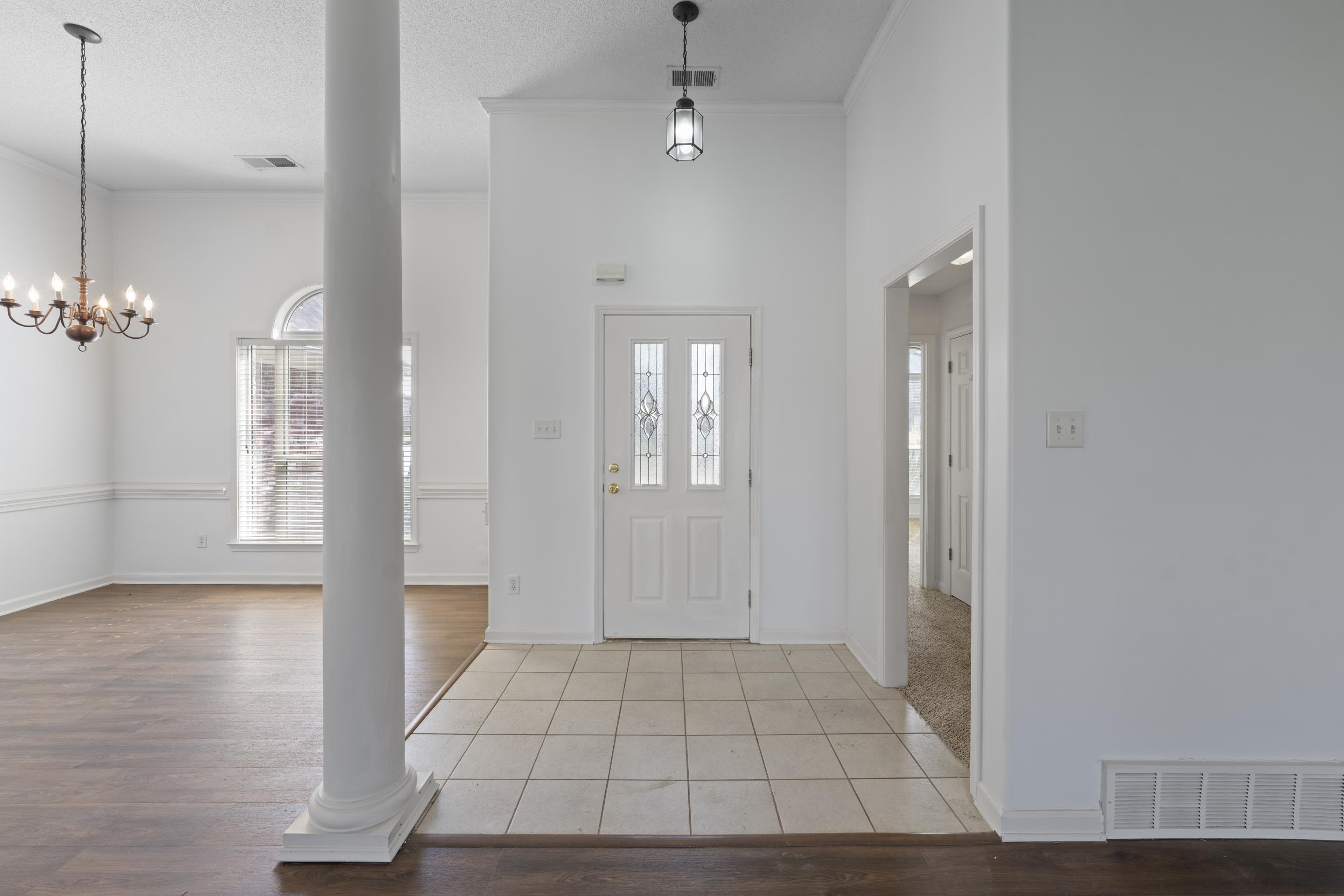 1104 Macon Hall Road Cordova, TN 38018 - Photo 2 of 34 Foyer entrance featuring decorative columns, visible vents, and ornamental molding