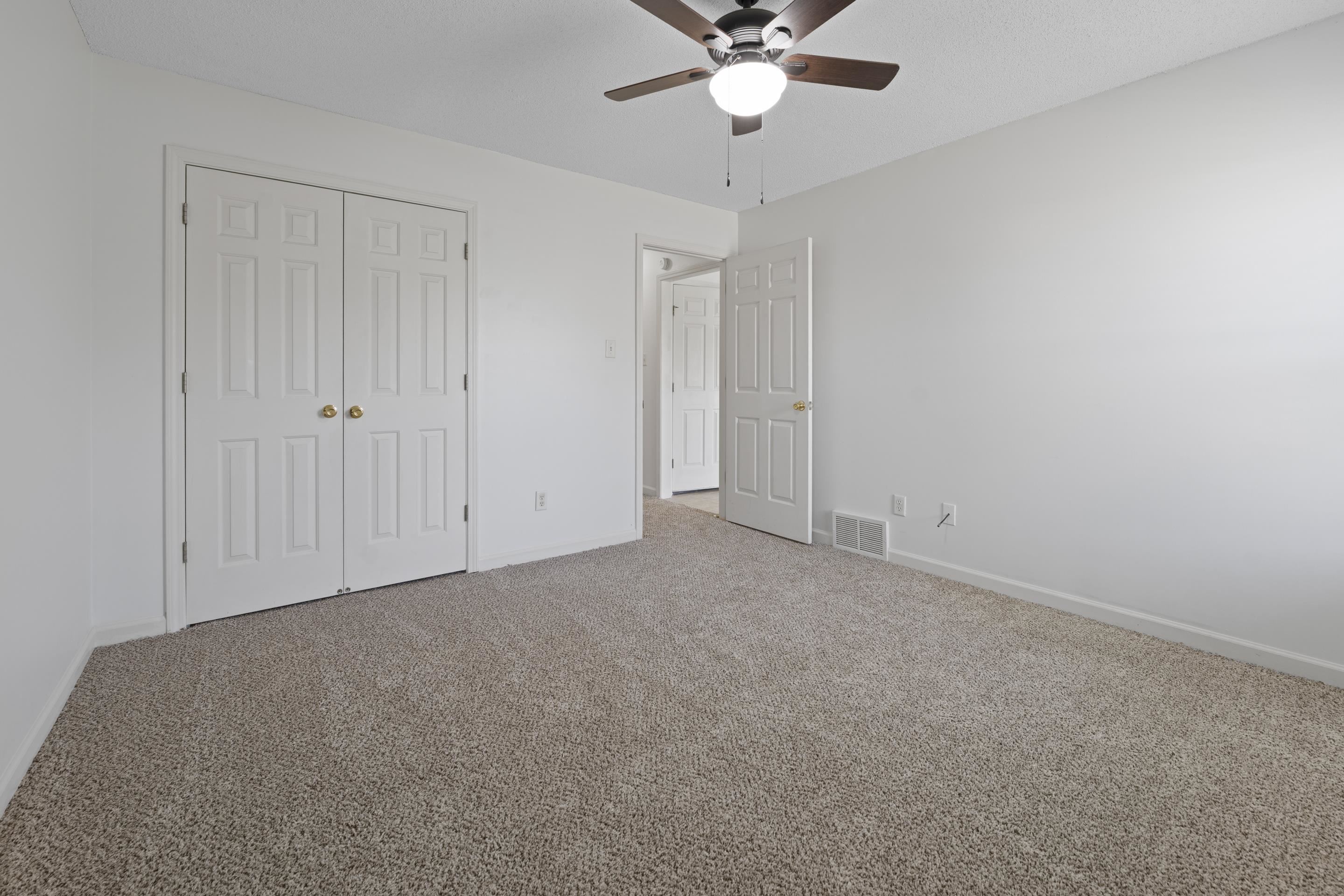 1104 Macon Hall Road Cordova, TN 38018 - Photo 22 of 34 Unfurnished bedroom featuring a closet, carpet flooring, visible vents, and baseboards