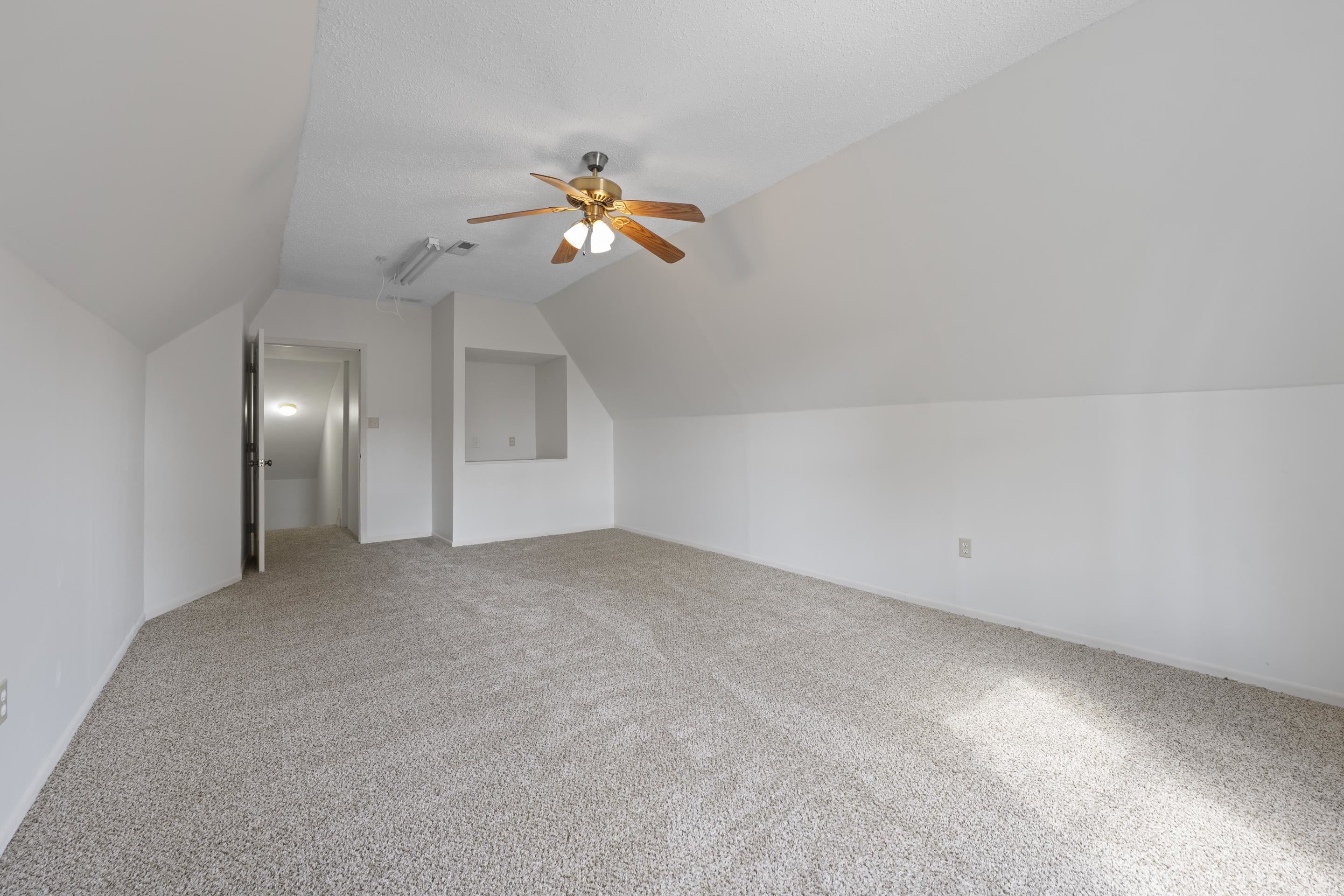 1104 Macon Hall Road Cordova, TN 38018 - Photo 27 of 34 Additional living space with ceiling fan, carpet flooring, and vaulted ceiling