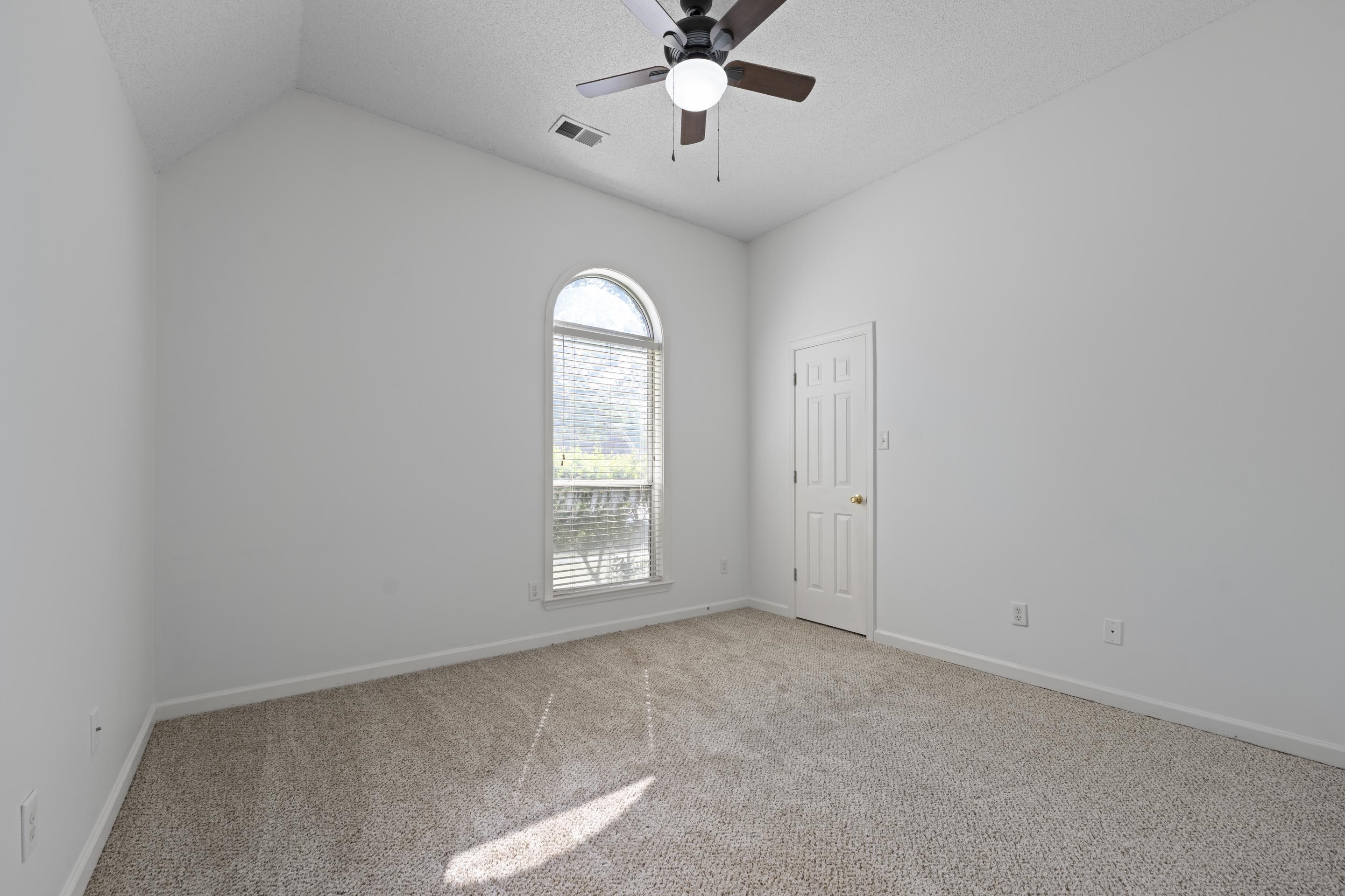 1104 Macon Hall Road Cordova, TN 38018 - Photo 7 of 34 Unfurnished room featuring light carpet, visible vents, baseboards, and ceiling fan