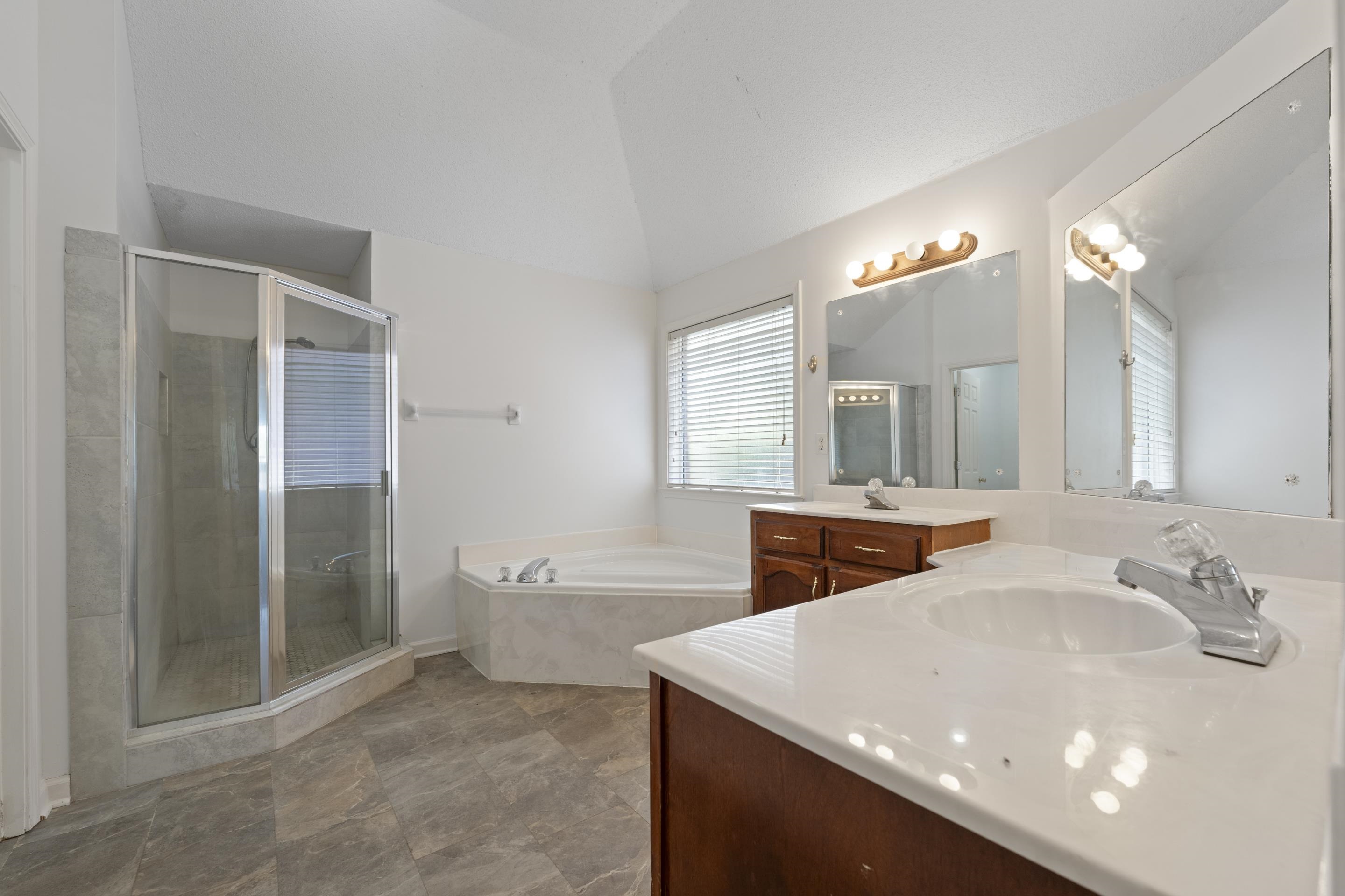 1104 Macon Hall Road Cordova, TN 38018 - Photo 10 of 34 Full bath featuring a shower stall, a bath, vanity, and vaulted ceiling