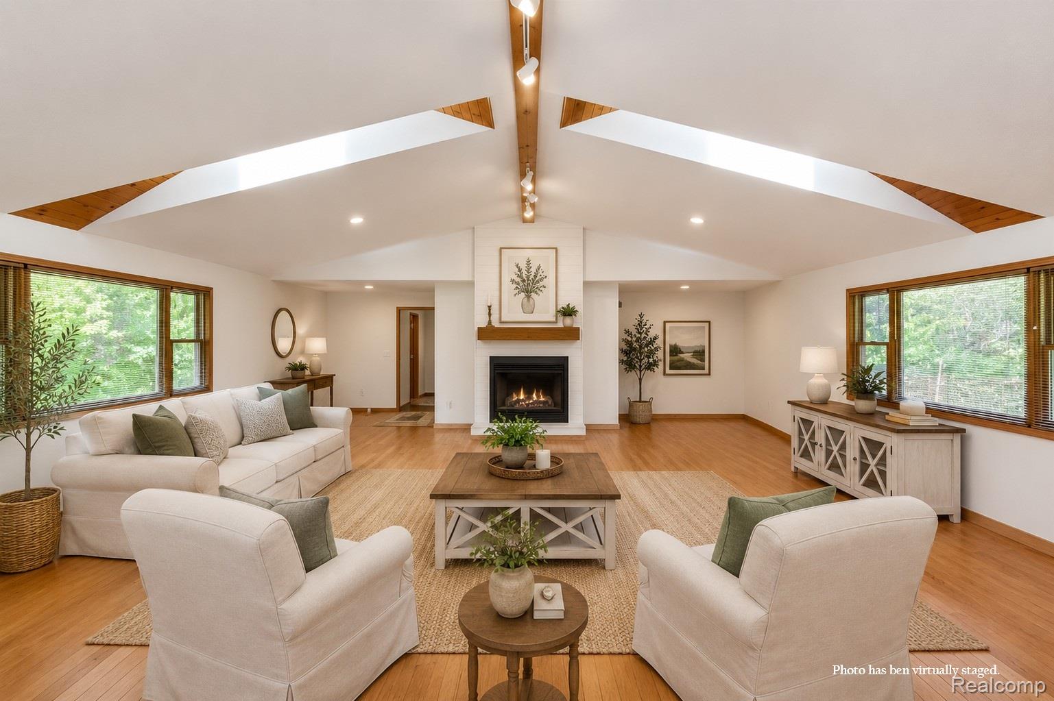 10201 Washburn Road Goodrich, MI 48438 - Photo 18 of 85 Vaulted ceiling with exposed wood beams and skylights