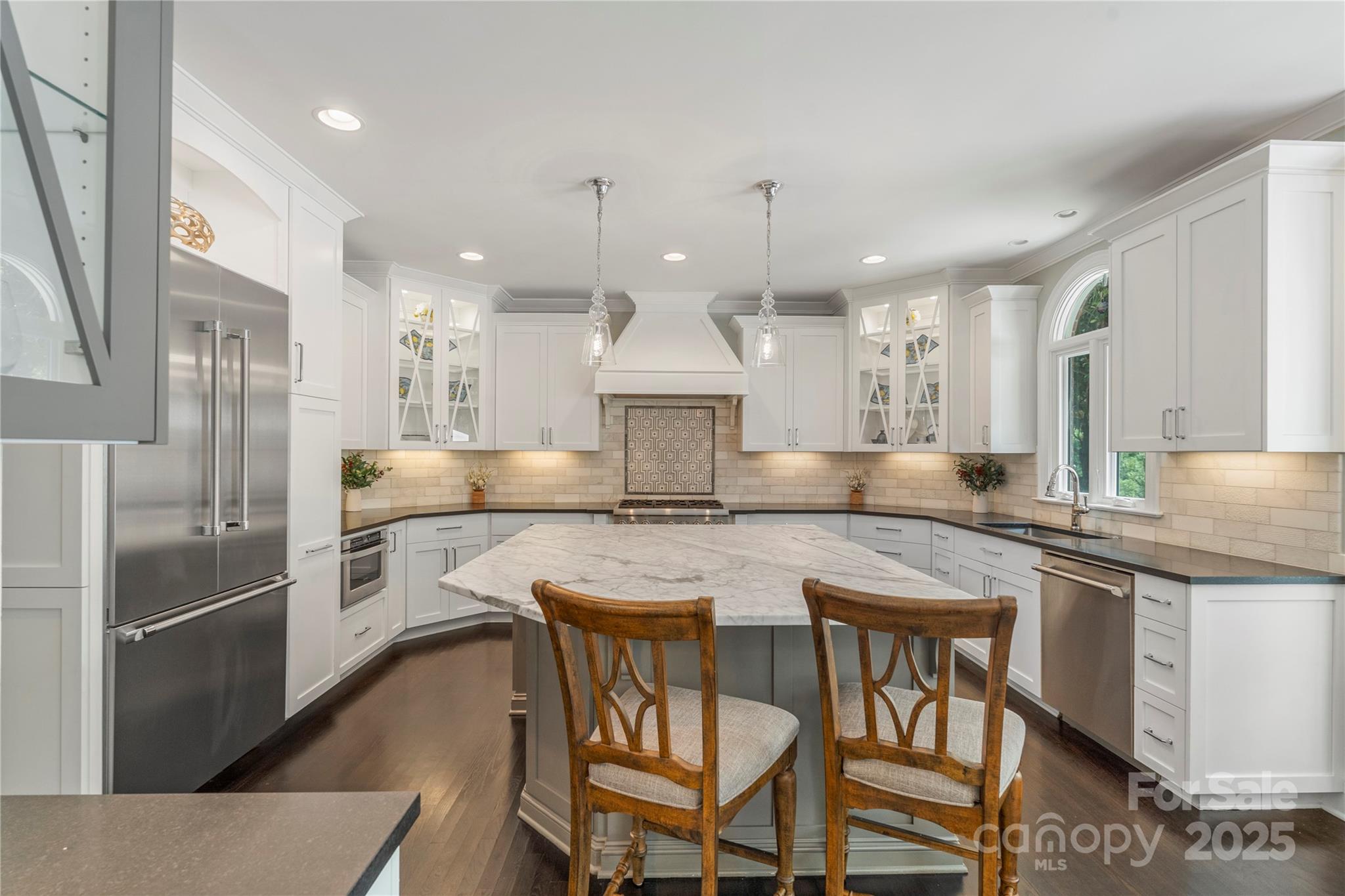 14654 Trading Path Way Charlotte, NC 28277 - Photo 14 of 48 a kitchen with stainless steel appliances granite countertop a kitchen island a stove a table and chairs