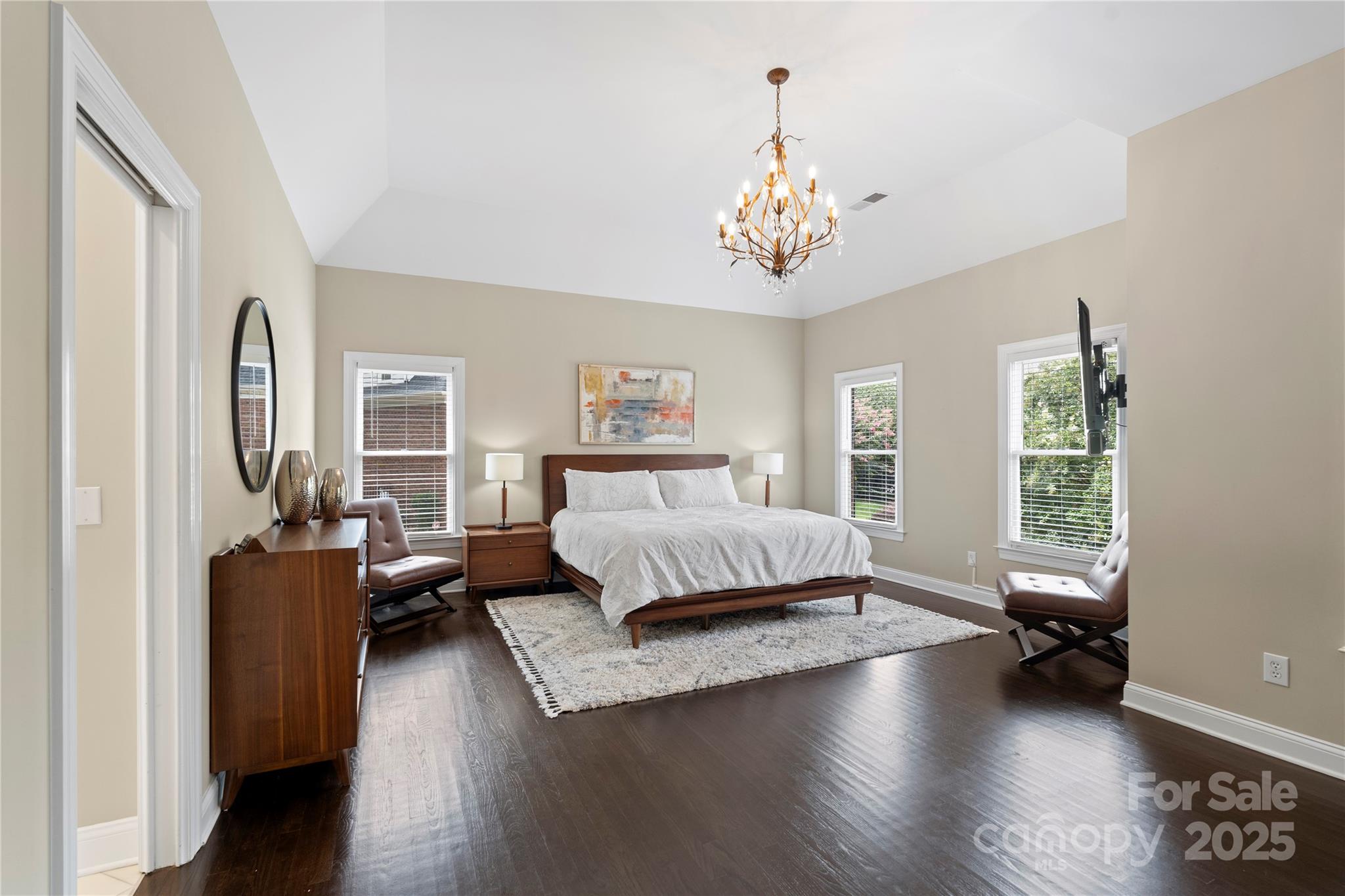 14654 Trading Path Way Charlotte, NC 28277 - Photo 26 of 48 a spacious bedroom with a bed and wooden floor